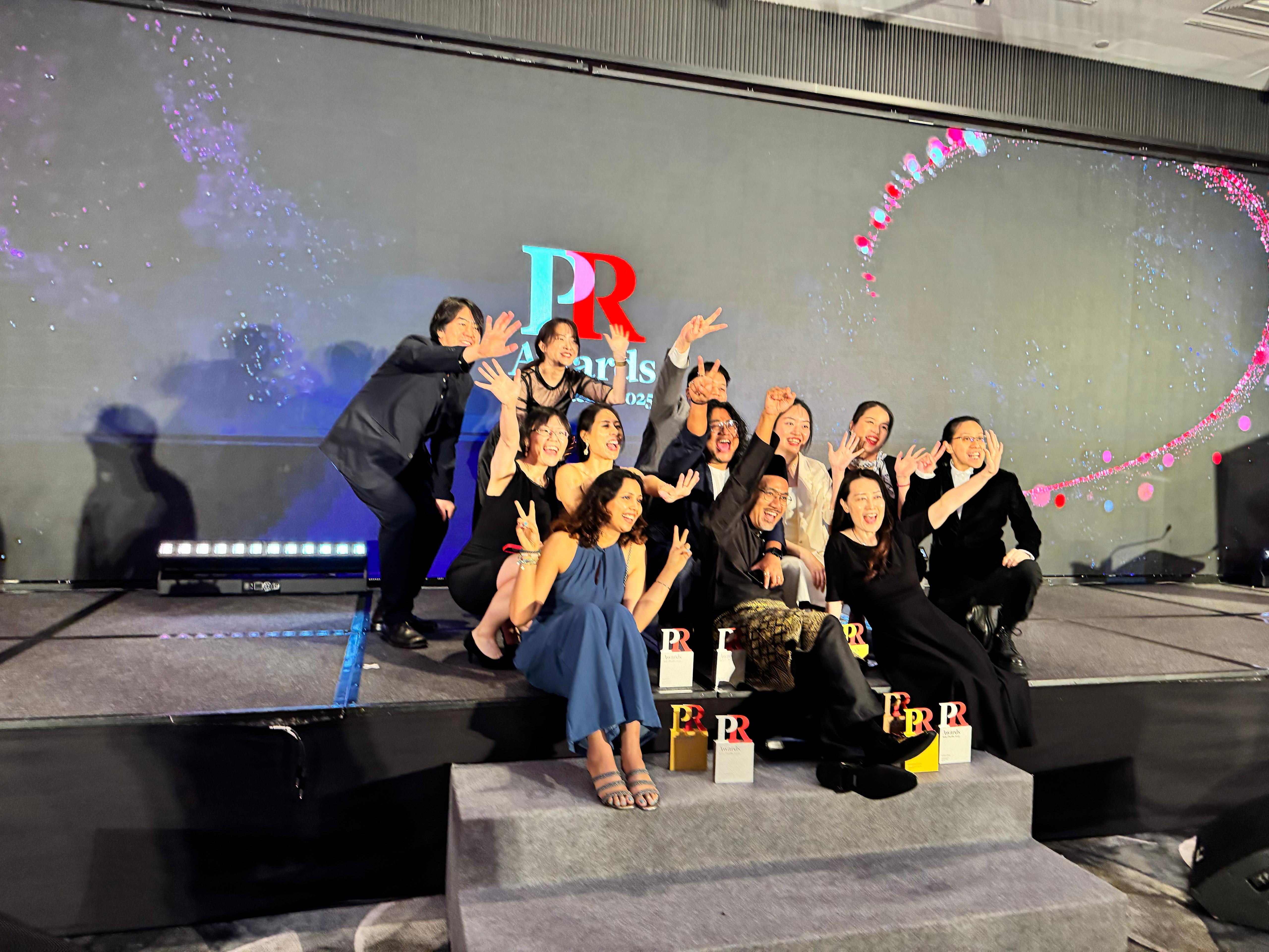 Celebrating a win on stage at the PR Awards Asia-Pacific